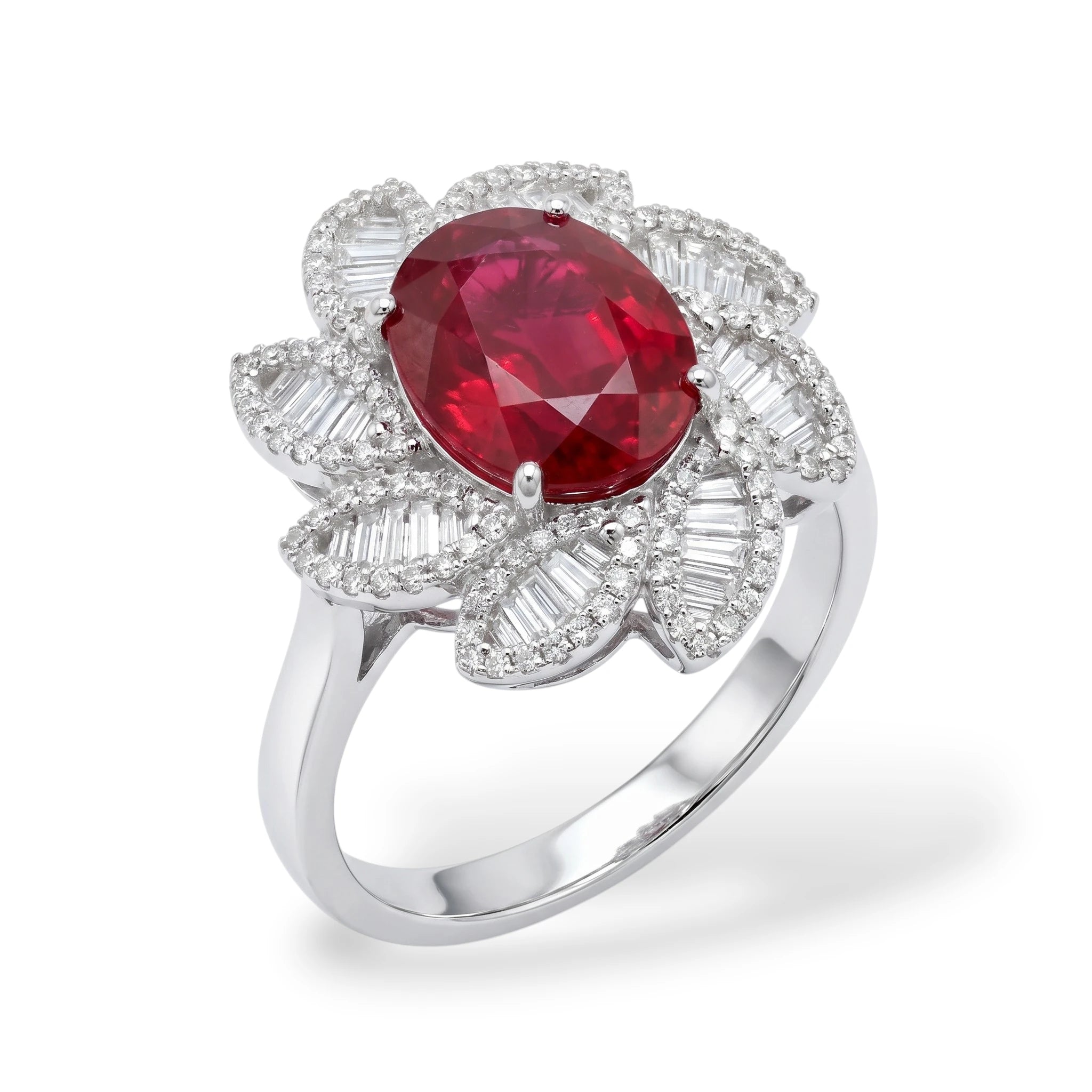 A silver-tone ring featuring a large oval-cut red ruby center stone surrounded by a halo of baguette-cut and round-cut clear stones, shown on a white background.