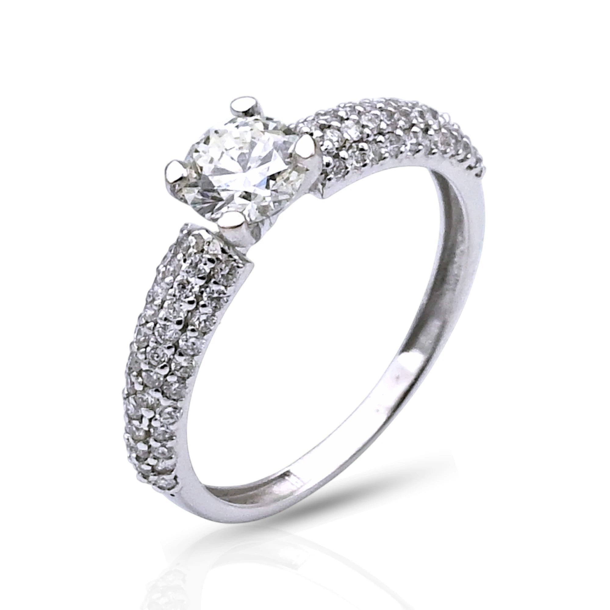 Kef Diamonds 18k white gold engagement ring featuring a 0.54ct round solitaire diamond and pavé-set diamond band.
